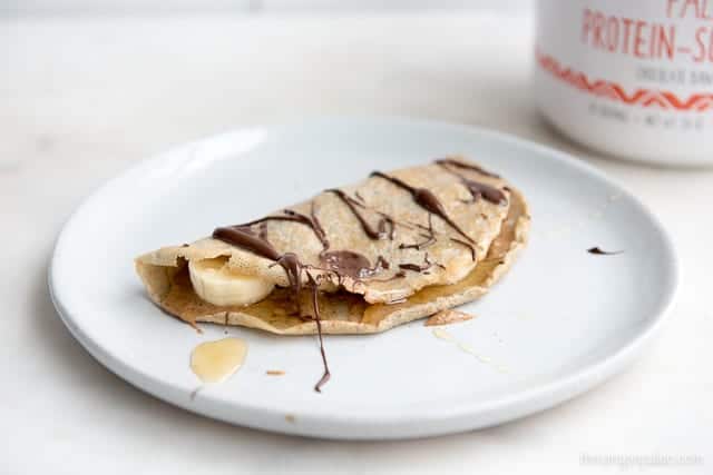 Paleo Protein Crepes with bananas, almond butter and chocolate using Rootz Paleo Protein-Superfood powder - recipe for crepes in post