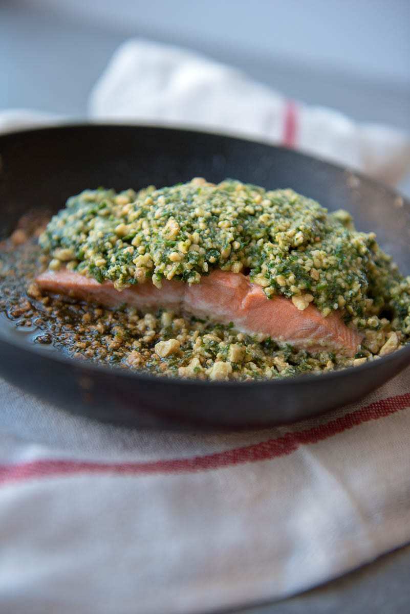 long picture of keto salmon filet in pan with cashew coating