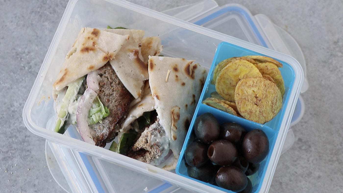 AIP gyro wrap in a lunchbox with a toothpick