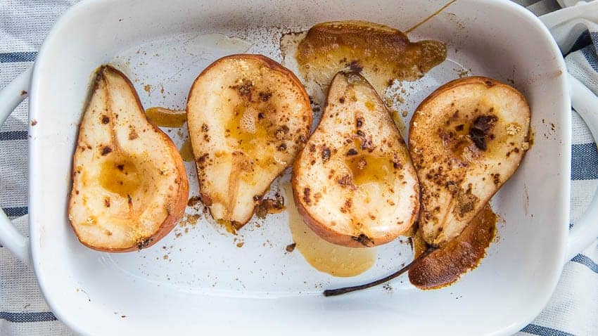overhead shot of the baked pears in a baking dish