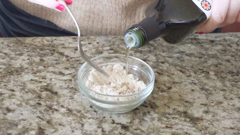 Mixing the tigernut flour and avocado oil with a fork