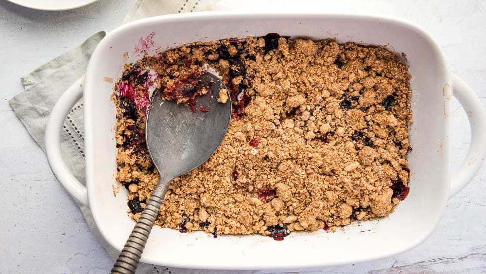 pan filled with berry crumble