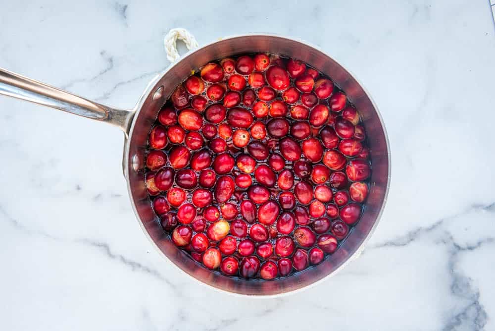 whole fresh Cranberries in water in a saucepan