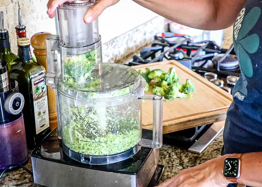 Broccoli being put through a food processor to make rice