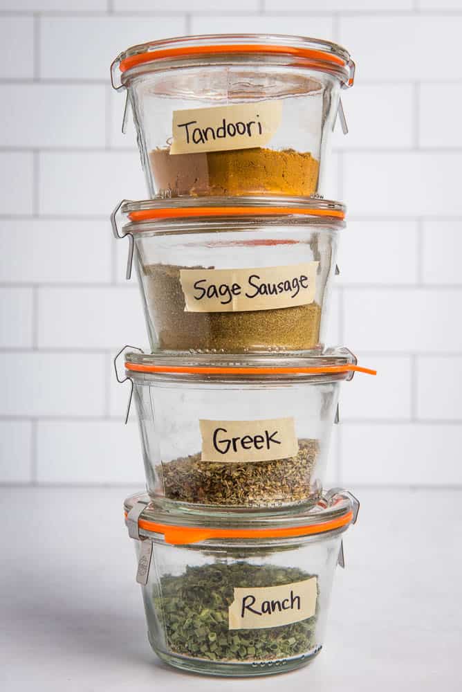 4 paleo aip seasoning mixes in jars, stacked on top of each other